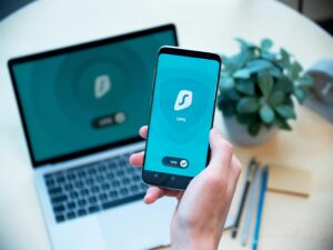 Cybersecurity tips for remote workers showing secure laptop, VPN connection, and password protection setup at home office.