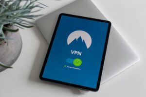 Cybersecurity tips for remote workers showing secure laptop, VPN connection, and password protection setup at home office.