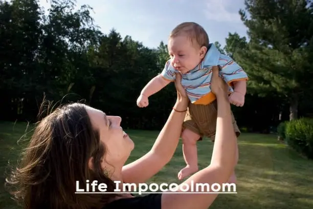 Mother holding her baby outdoors, symbolizing Life Impocoolmom values of love, confidence, and balanced motherhood.